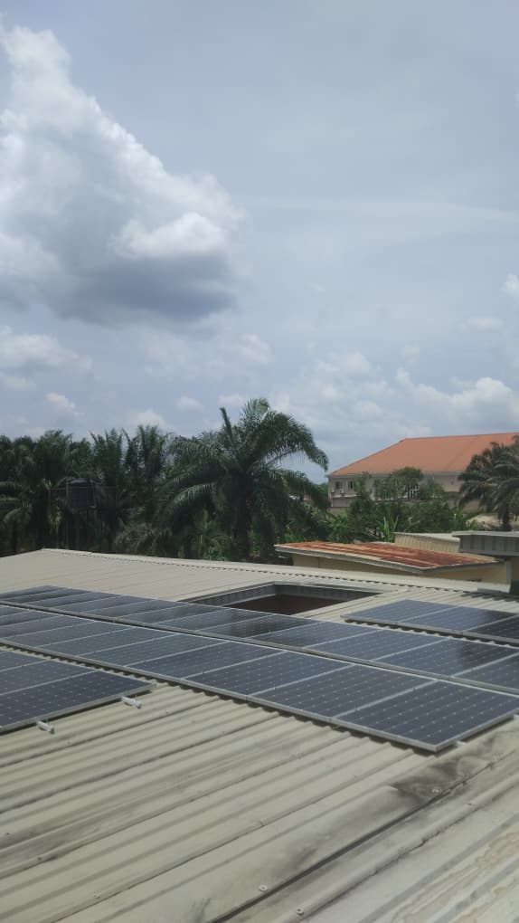 Technician inspecting solar installation